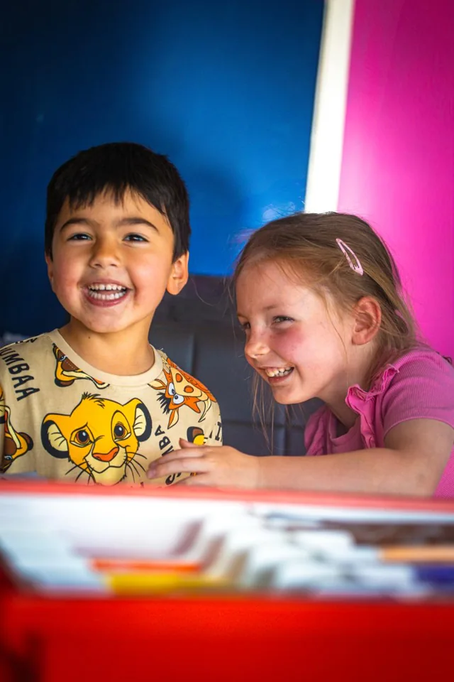 Two children enjoying a class at The Piano Lab